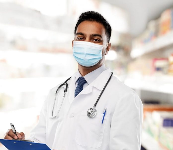 stock-photo-medicine-pharmacy-and-healthcare-concept-indian-male-doctor-or-pharmacist-wearing-face-1728866404-transformed