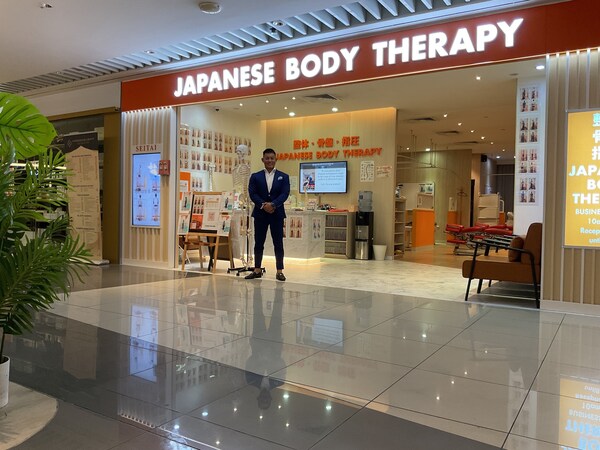 Yuta Kizaki, CEO of MJG International Pte Ltd standing at Japanese Body Therapy storefront
