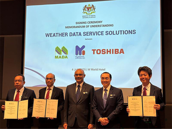The signatories hold the signed MoU: Zulkifli bin Romli, General Manager of MADA; Adrian Marcellus, CEO of MyDIGITAL Corporation; and Naoki Yamaguchi, General Manager of ICT Solutions Division, Toshiba Digital Solutions Corporation (left to right)