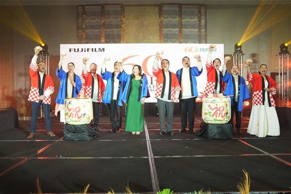 FUJIFILM BI executives and guests toast during sake barrel ceremony.