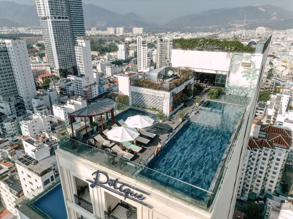 Unwind at the rooftop pool with views of the mountains and the coastal city. Photo: Svetline.