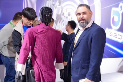 Visitor interacts with AgiBot A2 at CIIE (PRNewsfoto/AgiBot Innovation (Shanghai) Technology Co.,Ltd.)
