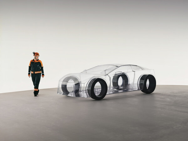 A dedicated Sandvik engineer walks around the eNimon, assessing the eNimon, which highlights the critical, often unseen, reliance on robust mining infrastructure to power the EV future. A dedicated Sandvik engineer walks around the eNimon, assessing the eNimon, which highlights the critical, often unseen, reliance on robust mining infrastructure to power the EV future.