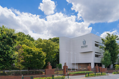 Malvern College Tokyo campus set against a backdrop of lush greenery and a clear blue sky. Malvern College Tokyo campus set against a backdrop of lush greenery and a clear blue sky.
