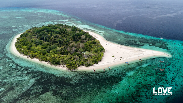 In Camiguin’s Mantigue Island, visitors can relax and be one with nature on its serene white sand beach surrounded by crystal clear waters. Mantigue Island, Camiguin, Philippines | Courtesy of Department of Tourism