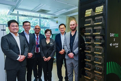 Photo shows representatives from DayOne Data Centers, Cortical Labs and NUS Medicine at the first biological data center prototype showcase