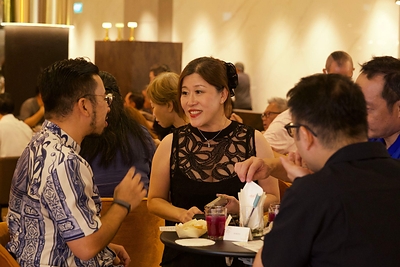 Guests mingling in the stylish venue with welcome drinks in hand at Bold Thai Guests mingling in the stylish venue with welcome drinks in hand at Bold Thai