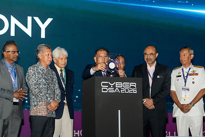 YB Datuk Wilson Ugak Anak Kumbong, Deputy Minister of Digital Malaysia (middle), officially opens CyberDSA 2026 at the Malaysia International Trade and Exhibition Centre (MITEC), Kuala Lumpur, on 5 October 2026. The Deputy Minister is accompanied by Encik Ma. Sivanesan, Deputy Secretary General (Digital Development), Ministry of Digital, Dato’ Shaharuddin bin Abu Sohot, Secretary General, Ministry of Tourism, Arts and Culture Malaysia, Tan Sri Asmat Kamaludin, Chairman of Aerosea Exhibitions Sdn Bhd, Dato’ Sri Noor Hisam bin Nordin, Director of Crime Prevention and Community Safety Department of the Royal Malaysia Police, Encik Shakib Ahmad Shakir Jamaludin, Deputy Secretary General (Strategic & Management), Ministry of Digital, and Rear Admiral Dato' Fadhil bin Abdul Rahman, Commander, Defence Cyber and Electromagnetic Command, Malaysian Armed Forces. YB Datuk Wilson Ugak Anak Kumbong, Deputy Minister of Digital Malaysia (middle), officially opens CyberDSA 2026 at the Malaysia International Trade and Exhibition Centre (MITEC), Kuala Lumpur, on 5 October 2026. The Deputy Minister is accompanied by Encik Ma. Sivanesan, Deputy Secretary General (Digital Development), Ministry of Digital, Dato’ Shaharuddin bin Abu Sohot, Secretary General, Ministry of Tourism, Arts and Culture Malaysia, Tan Sri Asmat Kamaludin, Chairman of Aerosea Exhibitions Sdn Bhd, Dato’ Sri Noor Hisam bin Nordin, Director of Crime Prevention and Community Safety Department of the Royal Malaysia Police, Encik Shakib Ahmad Shakir Jamaludin, Deputy Secretary General (Strategic & Management), Ministry of Digital, and Rear Admiral Dato' Fadhil bin Abdul Rahman, Commander, Defence Cyber and Electromagnetic Command, Malaysian Armed Forces.